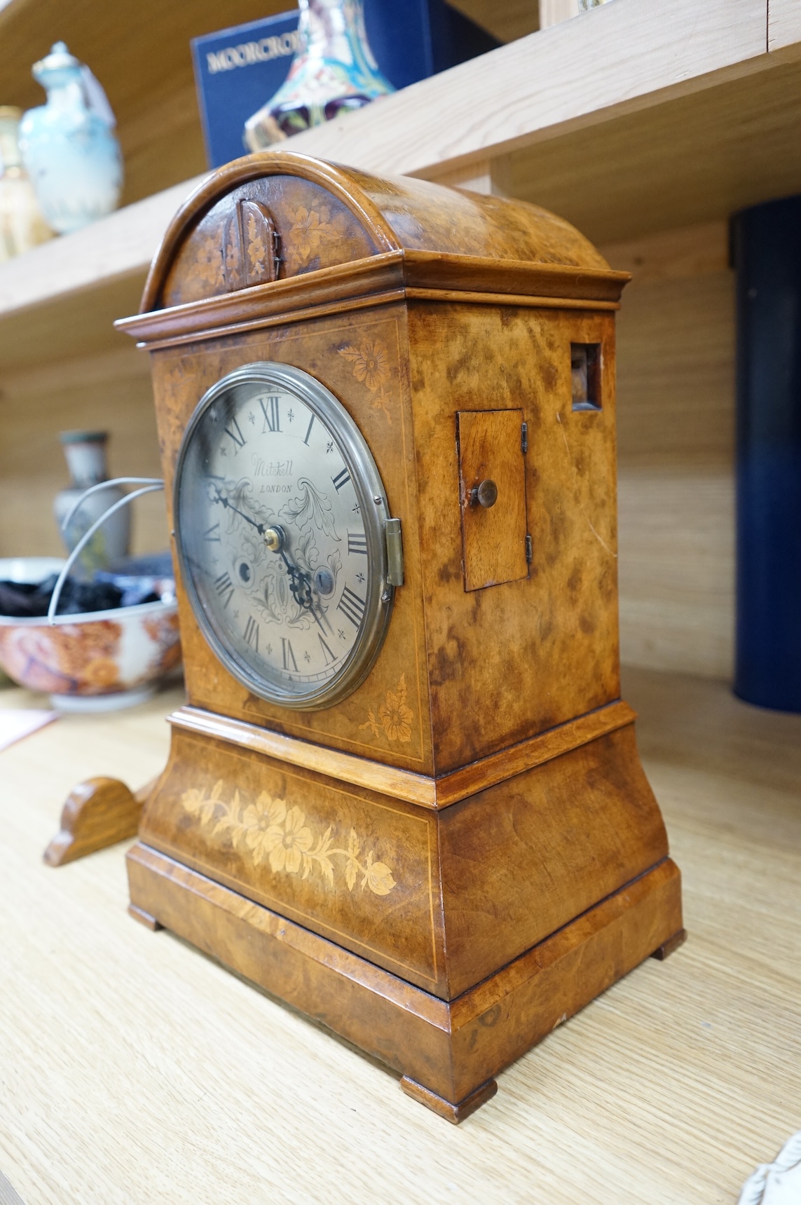 A Victorian burr walnut and marquetry dome topped cuckoo clock, signed Mitchell, London, with oak bracket, 41cm high